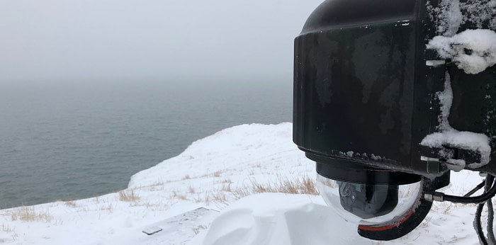 XClear self-cleaning camera enclosure system installed on Round Island in Alaska.