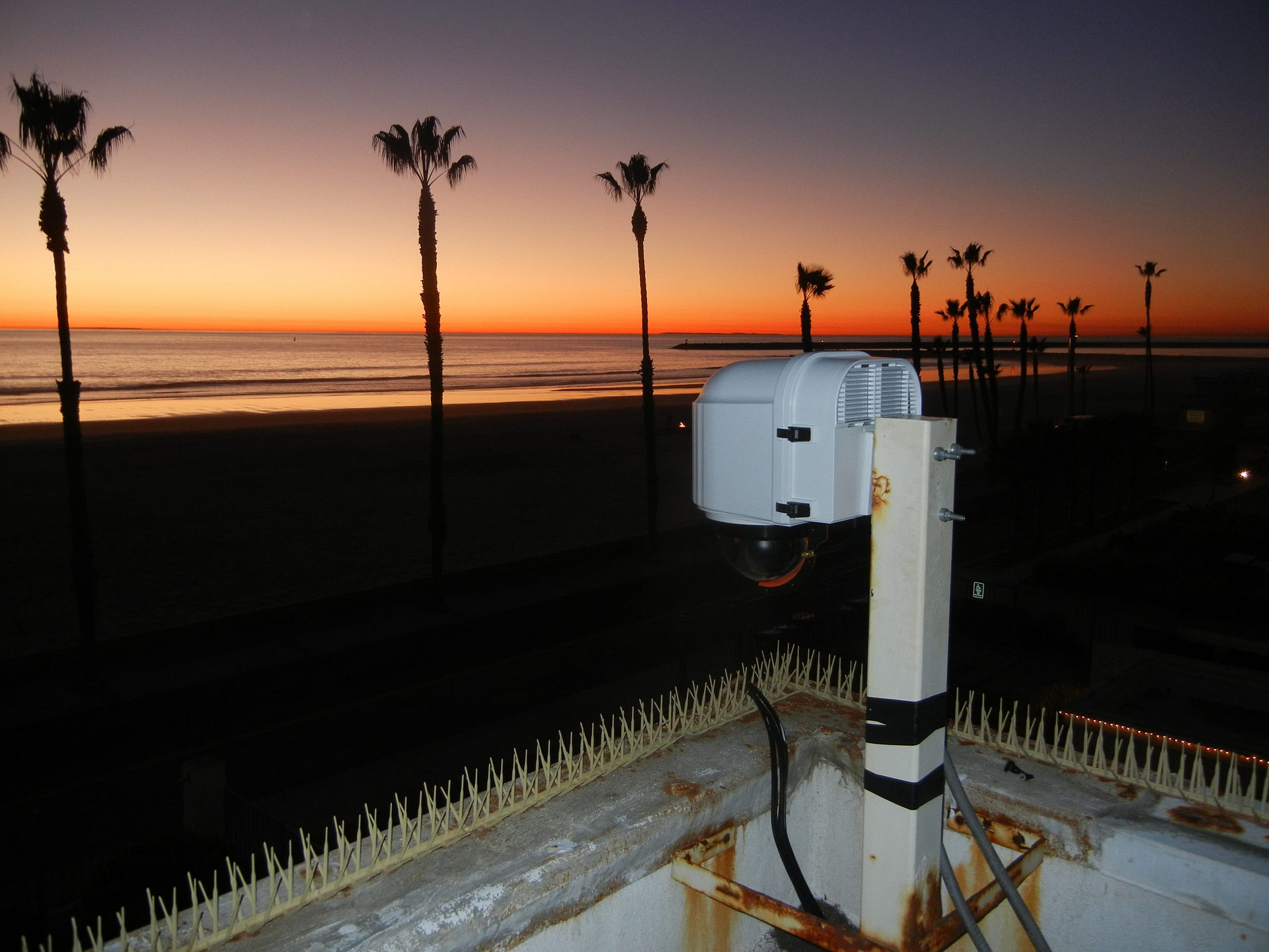 XClear Self Cleaning Camera Enclosure System Installed In Oceanside California Overlooking The Surf During Sunset 